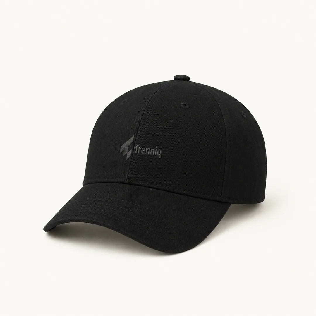The Signature — Trenniq black six-panel cap with embroidered logo